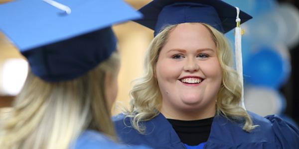 你ng woman in graduation cap and gown